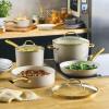 imageFarberware Forged Induction Ceramic Nonstick Pots and Pans Set with Lids and Kitchen Cooking Tools  Dishwasher Safe Suitable for All Stovetops 12 Piece Cookware Set  Black and GoldTaupe